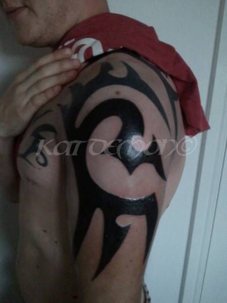 chopper arm tribal tattoo